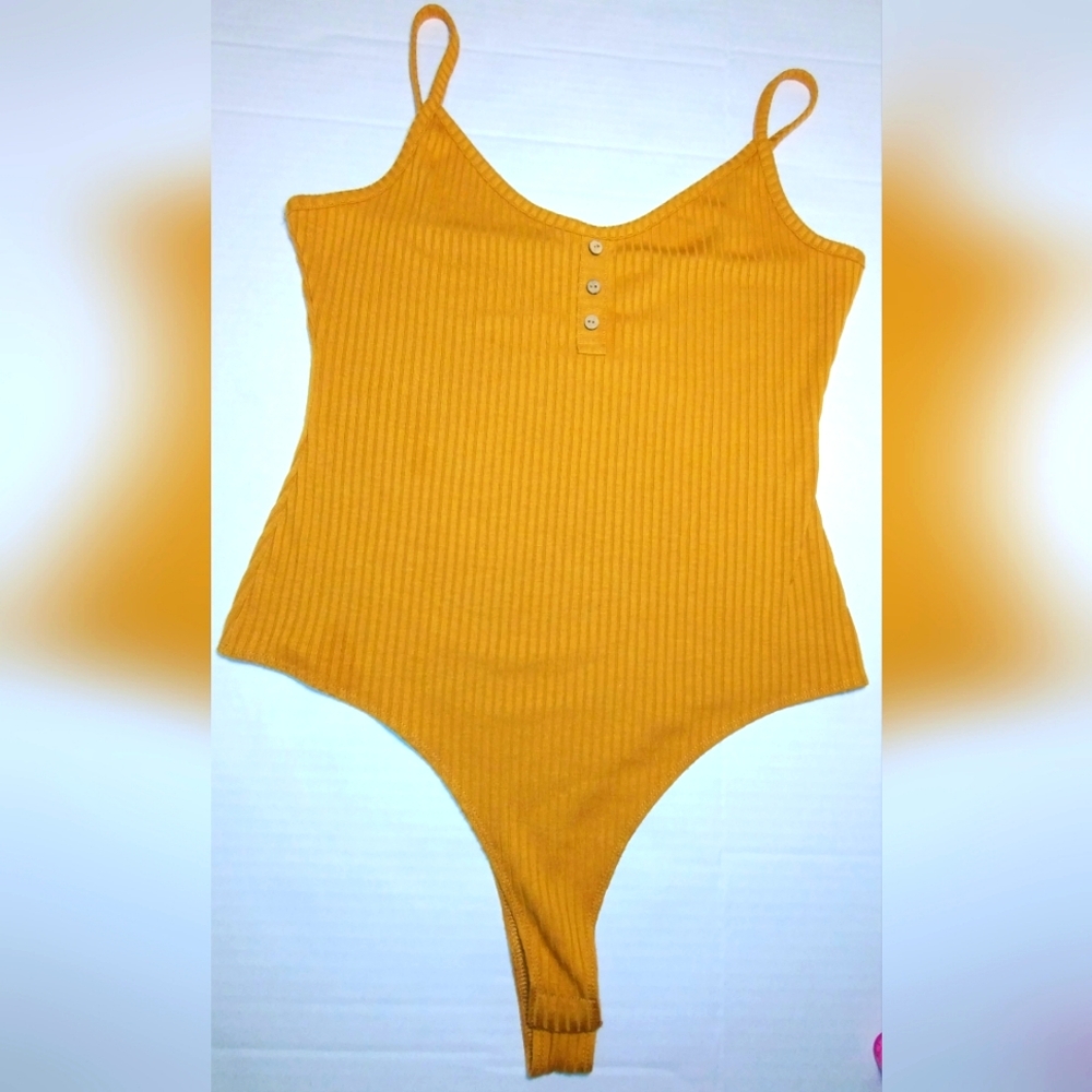 Rue21 mustard-colored ribbed bodysuit, size XL button on the bottom